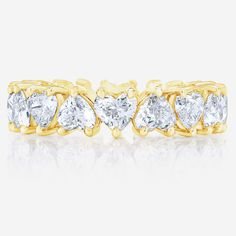 This heart shaped diamond eternity band makes a perfect wedding band or right hand ring. Made to order in platinum or gold with diamonds of all sizes and qualities. Platinum or 14k solid gold Diamonds: G/H color VS clarity 3.66 carats, 18 diamonds (~.20 pt each) Carat total weights based on finger size 6 4.35 mm width We recommend ordering 1/4 of a size up from your true finger size to avoid a snug fit, as eternity bands cannot be resized This item is Final Sale and excluded from all promotional Gold Moissanite Eternity Band With Vvs Clarity, Gold Cubic Zirconia Eternity Band For Anniversary, Yellow Gold Lab-grown Diamond Eternity Band Promise Ring, Gold Eternity Band With Single Cut Moissanite Diamonds, Gold Moissanite Eternity Band With Single Cut Diamonds, Gold Cubic Zirconia Eternity Band With Prong Setting, Gold Diamond Round Cut Eternity Band, Luxury Cubic Zirconia Eternity Band With Vvs Clarity, Gold Diamond Eternity Band With Round Cut