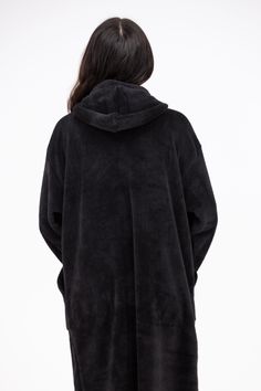 The Drift Away Hoodie is a closet must have. This faux fur hoodie features a super longline body, large pockets, an elasticized wrist cuff, and a straight hem. The Drift Away Hoodie is perfect for a ay of lounging or can be used as a toasty robe! Fabric: 100% Polyester One size fits most! Comfy Outerwear With Adjustable Hood For Loungewear, Cozy Hooded Jacket With Adjustable Hood For Loungewear, Cozy Fit Outerwear With Adjustable Hood For Loungewear, Oversized Hooded Jacket With Adjustable Hood For Loungewear, Oversized Hooded Jacket With Double-lined Hood For Loungewear, Black Outerwear With Kangaroo Pocket For Loungewear, Oversized Outerwear With Adjustable Hood For Loungewear, Hoodie With Kangaroo Pocket For Loungewear, Solid Outerwear With Kangaroo Pocket For Loungewear