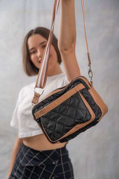 This is a super versatile purse, you can use it as a cross body bag, shoulder bag, fanny pack or a clutch!  Comes with a detachable strap made in striped fabric.  The fabric strap can be in different pattern if there is no availability of the shown one. Made with solid puffed nylon, with genuine leather details in the sides and front. 100% Handmade one by one in our small studio. Ready to ship! Shipping through private courier 3-7 business days to reach any destination.   Features: * One detachable shoulder/belt straps * Exterior pocket in the front * Fabric lining  * Upper closure with YKK zipper. Available Colors: Black puffed with Caramel leather Black puffed with  White leather Black puffed with  Black leather Green puffed with Black  leather Please contact me if you would like to get Functional Quilted Shoulder Bag For Everyday Use, Everyday Functional Quilted Shoulder Bag, Modern Quilted Shoulder Bag For Everyday, Modern Quilted Everyday Shoulder Bag, Versatile Quilted Leather Bag, Versatile Quilted Crossbody Shoulder Bag, Versatile Quilted Leather Shoulder Bag, Functional Quilted Crossbody Bag, Versatile Quilted Pouch Bag