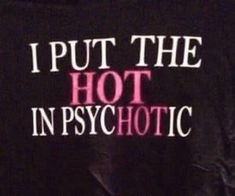 i put the hot in psychic t - shirt on top of a bed with pink writing