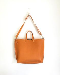 The Bernadette Minimalist Rectangular Satchel With Leather Handles, Everyday Soft Leather Tote Briefcase, Minimalist Tote Bag With Smooth Grain, Minimalist Smooth Grain Tote Shoulder Bag, Minimalist Smooth Grain Tote Bag, Minimalist Satchel With Leather Handles, Cognac Tote Briefcase For Everyday, Everyday Cognac Tote Briefcase, Everyday Smooth Grain Tote Briefcase