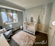 a baby's room decorated in gray and white