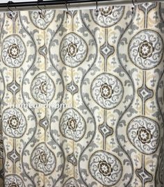 a shower curtain with an ornate design on it