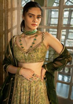 Featuring sage green lehenga set in our signature combination prints paired with a tissue dupatta with antique gold hand embroidery. Green Indian Outfit, Sage Green Lehenga, Tissue Dupatta, Shyamal And Bhumika, Gold Lehenga, Printed Lehenga, Raw Silk Lehenga, Satin Fashion, Green Lehenga