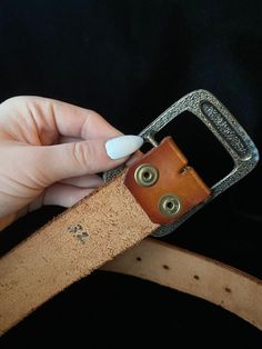 1980's brown tooled leather belt with an eyelash/sun ray pattern and the name Kyle tooled on it. Has some wear but looks like it's never been wornlabeled as size 32, measures 37.75 inches in length Vintage Hand Tooled Leather Belt Buckles, Adjustable Brown Belt With Brass Buckle, Brown Hand Tooled Adjustable Belts And Suspenders, Rustic Distressed Brown Belt Buckle With Antique Design, Adjustable Brown Belts With Antique Buckle, Adjustable Hand Tooled Brown Belt, Adjustable Hand-tooled Brown Belt, Adjustable Rustic Brown Belt, Rustic Adjustable Brown Belt