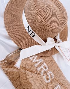 Ladies fedora straw hat with pearl ribbon and personalisation. Pearls are hand embellished to the ribbon. The hat is a tan straw with a white ribbon which is personalised in either rose gold or black vinyl. The ribbon is held in place through metal eyelets.  Pearls are additional and must be selected using the drop down box above Perfect hat for holidays, hen parties or your honeymoon or to give as a gift. Bulk orders can be made for your hens or bride squad. Some personalised options include:  - Name - Monogram Initials - Bride - Mrs - Wifey Main Material: Straw Other Materials: Satin ribbon Lettering: HTV Main Colour: Tan Straw Ribbon Colour: White  Size: 32cm*32cm (brim to brim approx.) Circumference: 56-58cm (approx.) Turnaround time is around 2 weeks due to personalisation and all ite Ribbon Lettering, Beach Bachelorette Party Favors, Bridal Party Hats, Straw Beach Hat, Bachelorette Hats, Pearl Ribbon, Honeymoon Gift, Floppy Beach Hat, Straw Hat Beach