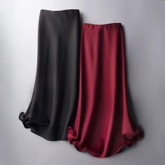 An elegant essential for any woman’s wardrobe, our High Waist Solid Satin Skirt will take your look to the next level. Featuring a high-waisted and flowing silhouette and a tasteful ruffled hem, this skirt is an elevated piece, perfect for the more formal events in your life. Luxury Solid Lined Skirt Bottoms, Luxury Solid Color Formal Maxi Skirt, Luxury Ruched Elegant Skirt, Satin Skirt 2022, Luxury Satin Feminine Bottoms, Luxury Stretch Skirt For Parties, Luxury Solid Color Maxi Skirt For Formal Occasions, Luxury Classic Skirt For Party, Elegant Luxury Velvet Skirt