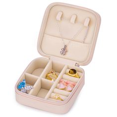 an open jewelry box filled with lots of rings