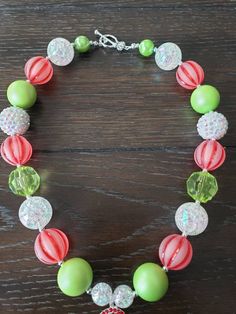 "How The Grinch Stole Christmas Inspired Children's Chunky Bubblegum Bead Necklace & Bracelet Set/ Holidays This very cute Christmas Grinch Necklace & Bracelet Set is a perfect addition to any holiday outfit and the holiday season. The Necklace is made up primarily of 20mm beads in shades of red, green and white. The necklace measures approximately 11\" when toggled around neck including the Grinch pendant. The Bracelet is an elastic bracelet, doubled up for extra strength. The Necklace Adjustable Pink Holiday Jewelry, Adjustable Pink Jewelry For Holiday, Adjustable Multicolor Jewelry For Holiday, Adjustable Green Beads For Festive Occasions, Adjustable Green Jewelry For Holiday, Adjustable Green Jewelry For Holidays, Pink Adjustable Christmas Jewelry, Green Bracelets For Christmas Party, Festive Christmas Beads With Round Shape