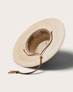 Discover the perfect blend of style and practicality with our Morro Fedora, handwoven by artisans from 100% tripilla palm straw. This lightweight accessory features a low depth fedora crown and an adjustable leather drawstring, making it an ideal choice for beachgoers and pool loungers alike. Pool Loungers, Lifeguard Hat, Pool Lounger, Straw Fedora Hat, Hat Size Chart, Straw Fedora, Kids Beanies, Boater Hat, Fedora Hat