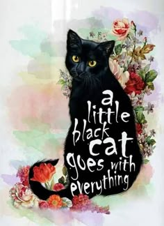 a black cat sitting on top of a table next to flowers