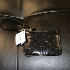 Small, Black Coach Wristlet, Never Used. Tags Are Still On But It Was Given As A Gift So The Price Was Taken Off. Willing To Negotiate! Black Rectangular Wristlet For Gift, Rectangular Black Wristlet For Gift, Rectangular Black Wristlet As A Gift, Elegant Black Wallet, Black Wallet With Wrist Strap For Gift, Black Wristlet With Zipper Closure For Gift, Black Wallet With Wrist Strap As Gift, Black Clutch Wristlet For Gift, Black Wristlet With Zipper Closure As Gift