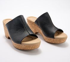 A leather upper and a cork-wrapped wedge make these gorgeous slides a must-have for fun in the summer sun. From Clarks Footwear. Casual Cork Wedge Sandals For Vacation, Casual Cork Slides For Summer, Comfortable Cork Slides For Summer, Cork Slides For Summer, Casual Cork Wedge Sandals With Leather Footbed, Cork Slides For Summer Beach, Summer Sun, Cork Wedge, Cork