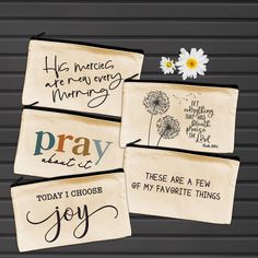 four embroidered tags with words on them and a daisy in the middle one says, he loves me every morning, pray that i choose of my favorite things joy