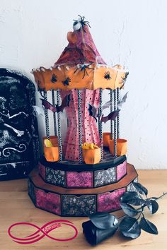 a carnival ride with candles and decorations on the table