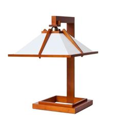 a wooden table lamp with a white shade on the top and brown trim around it