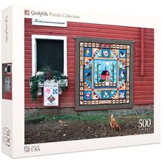 the puzzle box is open to show an image of a red house and chickens in front of it