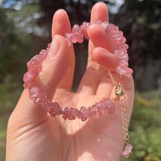 "Strawberry Quartz Chip Bracelet. Strawberry Quartz chip bracelet with gold accent lobster clasp. This beautiful bracelet has a pink color with red speckles. This bracelet is adjustable and would also make a great anklet. ♡♡ Makes a Beautiful Gift ♡♡ Strawberry Quartz: Gentleness, Serenity and Harmony * Strawberry Quartz Chips * Internal Metal Wires * Gold Lobster Clasp  ♡ View the store here: usagimarshmellow.etsy.com ♡ Follow on instagram: instagram.com/usagimarshmellow L E N G T H This is a adjustable bracelet so it will fit most wrists. Please message me if you have any concerns or want some extra help ♡ G I F T I N G & P A C K A G I N G Your bracelet will be packaged in a jewelry gift box or cotton to protect it during travel. Multiple items may be packed in one gift box.  Additionall Pink Beaded Bracelets With Lobster Clasp, Pink Gemstone Beaded Bracelets For Gift, Pink Gemstone Beaded Bracelets As Gift, Strawberry Quartz Bracelet, Bracelet Packing Ideas, Gold And Pink Jewelry, Cute Handmade Bracelets, Pink Quartz Jewelry, Pink Quartz Bracelet