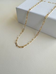 "Dainty Gold Filled paper clip chain necklace.    --------------------------------------------- >>  Length: 40cm or 45cm >>  Material: 14k gold filled   >>  Chain Dimensions: 2.5mm x 6.5mm >>  Hypoallergenic,nickel free,sensitive skin friendly&tarnish resistant. ------------------What is gold filled ------------------ Most of our findings and wires are made with 14k gold filled.\"Gold-filled\" is a USA industry standard that legally requires 5% pure gold by weight. It is a solid layer of gold bonded to another metal through heat and pressure. It does not wear off or turn colours over time, and if taken care of properly it can last a lifetime.Gold-filled jewellery is a cheaper, yet the best alternative to solid gold. It's hypoallergenic and water-safe." Teardrop Diamond Necklace, Minimalist Diamond Necklace, Paper Clip Chain Necklace, Custom Initial Necklace, Chain Necklace Gold, Silver Chain Style, Wedding Jewellery Necklace, Trombone, Layering Necklace