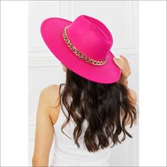 This super trendy felt hat comes in a beautiful fuchsia color that can bring a neutral outfit to life! This hat features a chain detailing and adjustable straps. Type: Fedora hat Pattern type: Contrast Material: 90% polyester, 10% plastic Imported Product measurements: Brim: 3.5 in Interior width: 6.8 in Height: 4 in Trendy Pink Fedora For Beach, Trendy Pink Fedora With Flat Brim, Trendy Pink Flat Brim Fedora, Trendy Pink Fedora With Short Brim, Chic Pink Fedora With Flat Brim, Trendy Pink Party Hat, Chic Pink Wide Brim Fedora, Chic Pink Winter Hat, Trendy Adjustable Pink Fedora