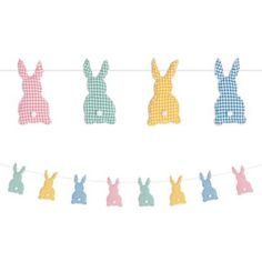 an easter bunnies banner hanging on a line with gingham checkered fabric