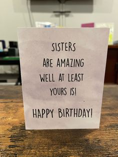 a sign that says sisters are amazing well at least yours is happy birthday