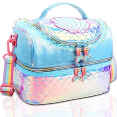 a blue and pink mermaid themed bag on a white surface with a rainbow strap around it