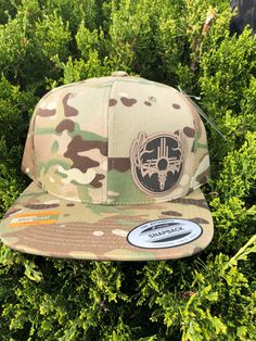 This is a snap back flat bill hat. It is the new Multi-Cam camo pattern Etched leather patches New Mexico GAME ON Zia elk or buck design One size fits most Military Snapback Hat With Flat Bill For Outdoor, Military Style Snapback Hat With Flat Brim, Casual Flat Bill Snapback Hat For Hunting, Outdoor Camouflage Snapback Hat With Flat Brim, Camouflage Snapback Hat For Outdoor, Military Camouflage Trucker Hat With Flat Brim, Casual Camouflage Snapback Hat With Flat Brim, Military Style Camouflage Trucker Hat With Flat Brim, Adjustable Camouflage Snapback Hat With Flat Bill