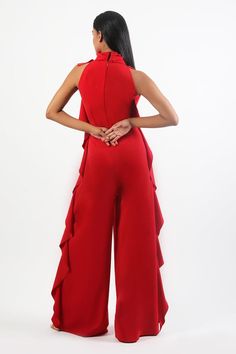 Red halter neck jumpsuit with side ruffles
Components: 1
Pattern: Plain
Neckline: Halter Neck
Sleeve Type: Sleeveless
Fabric: Heavy Crepe
Color: Red
Other Details: 
Attached inner lining
Occasion: Party - Aza Fashions Solid Evening Jumpsuits And Rompers With Ruffles, Chic Red Strapless Jumpsuit For Evening, Strapless Sleeveless Ruffles Jumpsuit For Date Night, Chic Strapless Jumpsuit With Ruffles For Evening, Chic Evening Strapless Jumpsuit With Ruffles, Elegant Strapless Jumpsuit With Ruffles For Party, Elegant Strapless Sleeveless Jumpsuit With Ruffles, Sleeveless Ruffled Jumpsuits For Formal Occasions, Fitted Strapless Sleeveless Jumpsuit With Ruffles