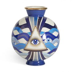 a blue and white vase with an all seeing eye on it