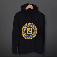 Fendi Roma 1925 Logo Hooded Sweatshirt 48 Description: Brand: Fendi Gender: Unisex Size: 48 Made In Italy %100 Cotton Color: Black, Fendi Yellow Color Printed. Condition: Fendi Model Hoodie. Excellent Condition , Like New. Tags Still Attached. There Is No Damage Or Stains. Check The Photos For More Details. What You See Is Exactly What You Will Receive Reasonable Offers Accepted! Designer Logo Print Sweatshirt For Winter, Designer Black Hoodie For Fall, Luxury Logo Print Tops For Winter, Luxury Logo Print Winter Tops, Luxury Black Hoodie With Logo Print, Fendi Hoodie, Givenchy Tshirt, Fendi Logo, Logo Sweatshirt