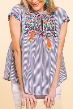 Pinata Embroidery Top :: NEW ARRIVALS :: The Blue Door Boutique Cotton Summer Top With Striped Hem, Summer Cotton Top With Striped Hem, Blue Spring Tops With Tassel Ties, Multicolor Summer Tops With Tassels, Summer Cotton Tops With Tassels, Blue Spring Top With Tassel Ties, Cotton Beach Tops With Tassels, Bohemian Striped Cotton Tops, Cotton Tops With Tassels For Vacation