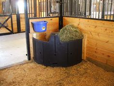 the inside of a stable with hay in it