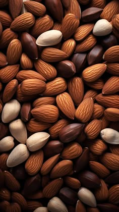 almonds and pistachio nuts are mixed together to make a textured background