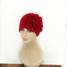 "This beautiful crochet hat with large flower on the side is my original design of 12 years and still sells the best. I hope you'll fine a color you like and get yours.  This hat best fits an average adult 22\" in circumference. We can easily customize it to fit other sizes as well! Leave a note at the check out if you need smaller or bigger size please. If you are interested in an item but would prefer a different size or color  feel free to contact us and we'll try to make it for you. The colo Red Crochet Beanie, One Size, Red Crochet Beanie One Size, Red Crochet Beanie, One Size Fits Most, Red Crochet Beanie From Yarn, Red Crochet Yarn Beanie, Red Yarn Crochet Beanie Hat, Red Crochet Beanie One Size Fits Most, Adjustable Brimmed Red Crochet Hat, Red One Size Crochet Beanie Hat