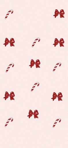 candy canes and bows on a pink background