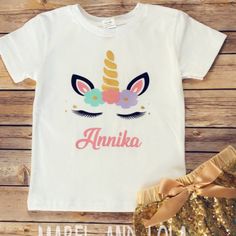 a t - shirt that says annika with an unicorn's face on it