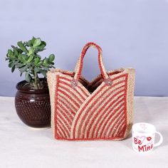 -: Handbag Tote Bohemian Jute Straw Handbag -: Size in cm:- Height-30 Cm Width- 10 Cm length-35 Cm -: Color - Brown And Red -: PRODUCTION AND SHIPPING TIME: Your bag is made 100% handmade in between 1 and 3 working days. Shipping time: Between 3 - 5 working days. Manufacturing - Made In India Handmade product The Indian Handmade Jute Quilted Women's Handbags from Rajasthan India. This Handbag is completely Indian Printed on good quality Jute. Cotton quilted Jhola Bag made by Indian Artisans, this cotton quilted shopping bag is totally unique and multi purpose. Use this for your grocery or as a travel bag. Perfect to suit all. Item :- Jute Handbag Material: 100% Jute Style: Tote Bag Product Work: Handmade storage bag Usage : Cosmetic, Make-up, Travel, Toiletries, Medicine, Accessories, Shop Jute Handbags, Beach Market, Indian Prints, Straw Handbags, Painted Books, Sustainable Gifts, Kids Items, Rajasthan India, Travel Toiletries