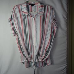 New With Tag Sanctuary Stripe Print Borrego Tie Shirt, Size Large. This 100% Rayon Button Front Top Has Pink, Red, Cream, Light Blue And Gray Vertical Stripes With Cuffed Cap Sleeves. It Has A Drawstring Tie Front With A High Low Hem.....Super Cute! Pit To Pit: 23" Shoulder To Hem: 25" In The Front And 28" In The Back Condition: New With Tags Casual Pink Blouse With Button Closure, Casual Multicolor Button-up Blouse, Casual Striped Short Sleeve Blouse, Striped Collared Tops For Day Out, Multicolor Relaxed Fit Top With Button Closure, Casual Multicolor Collared Blouse, Relaxed Fit Multicolor Tops With Button Closure, Casual Striped Cotton Blouse, Casual Striped Collared Tops