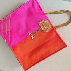 Tote bag  in silk fabric, pink orange , gold zari embroidery , velcro closure, golden hanging Size 14"x 16" , Guzzet - 4" Pink Rectangular Shoulder Bag With Handwork, Festive Pink Embroidered Shoulder Bag, Festive Pink Handcrafted Shoulder Bag, Festive Pink Bag With Zari Work, Pink Rectangular Shoulder Bag For Festive Occasions, Festive Pink Rectangular Shoulder Bag, Festive Rectangular Potli Gift Bag, Traditional Pink Shoulder Bag With Handwork, Traditional Rectangular Bags For Celebration