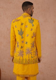 Make a striking impression with Yellow jacket Kurta. Crafted from luxurious georgette, the jacket features intricate resham and sequinned embroidery work and paired with a yoke design kurta. Fashioned with a same-color embroidered dupatta and trouser, this ensemble ensures both style and comfort with its pure lining. Perfect for Sangeet, Mehendi, Haldi, or as a wedding guest outfit. Composition : Jacket, Kurta, Trouser & Dupatta : Viscose Georgette Care: Dry Clean Only and Vacuum Storage This product can be customized for sleeves, length and colour Delivery : 4-6 weeks as the product is hand crafted. Check Size Guide or choose MySize for free customisation (All Sizes above XL can be made at 15% additional cost) For more information and sizes please contact fabiliciousfashion@gmail.com or v Kurta Set With Jacket, Design Kurta, Yoke Design, Vacuum Storage, Indian Wedding Wear, Embroidered Dupatta, Yellow Jacket, Kurta Designs, Kurta Set