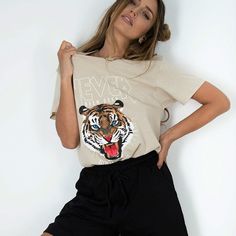 This is what you'll need this season! Our vintage wash Tiger tee has an edgy graphic that reads “Never Been Seenâ€?with a Tiger face for an extra chic edge! Layered or worn by itself. it's going to become a favorite! Tuck into jeans or skirts. OR wear it out with yogas/ biker shorts. Fits oversized. available in 3 colors! 100% Cotton Mineral Wash Machine Wash Cold. Tumble Dry Low Crew Neckline Short Sleeves T-shirt Sizes:S: Bust:96cm; Length:63cm; shoulder:43cm; Sleeve:18cmM: Bust:100cm; Length: Edgy Slogan T-shirt For Summer, Hear Me Roar, Shorts Fits, Y2k Tops, Tiger Face, Shirts Women Fashion, A Tiger, Biker Shorts, Graphic Tees Women