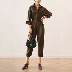 Elevate your style with our High-Street Quality Women's Jumpsuit. Crafted from breathable cotton broadcloth, this ankle-length jumpsuit offers both comfort and style. Perfect for spring/summer and fall fashion, it features a loose-fit silhouette and sash decoration for added flair. Shop now! Solid Color Overall Jumpsuits And Rompers For Fall, Solid Color Overalls Jumpsuit For Fall, Khaki Solid Color Jumpsuits And Rompers, Solid Color Overalls For Fall, Fall Solid Color Overall Jumpsuits And Rompers, Fall Color Jumpsuits And Rompers In Overall Style, Solid Color Fall Overalls, Spring Relaxed Fit Solid Color Jumpsuits And Rompers, Solid Relaxed Fit Jumpsuits And Rompers For Fall