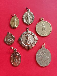 FREE SHIPPING Vintage mix of 7 religious Catholic French gold plated aluminum charms of Saint Christopher, Our Lady with Child Jesus and other rare medals. All 7 different. In vintage condition. Just send me a message whenever you have a question. I'm here to help! Shipping is for FREE. When you want insured mail or track and trace, please contact me about the options and costs. Love, Jackie ❤ Personalized Gold Spiritual Jewelry And Charms, Gold Spiritual Charms And Jewelry, Nickel Free Gold Spiritual Charms, Handmade Gold Spiritual Charms, Saint Christopher, Child Jesus, Our Lady, Notre Dame, Netherlands