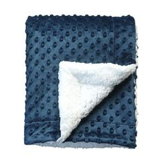 a blue and white blanket with dots on it