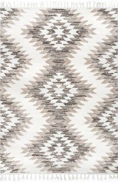 a white and brown rug with fringes on the bottom, in an abstract pattern