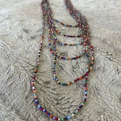 Nwot - Handmade Beautiful Layered Necklace 17” - 42” Length + 2” Extender Bohemian Lariat Jewelry With Tiny Beads, Multicolor Beaded Chain Necklace With Metal Beads, Festival Beaded Lariat Necklaces, Festival Lariat Beaded Necklace With Beaded Chain, Colorful Oval Beaded Jewelry For Festivals, Festival Jewelry With Colorful Oval Beads, Adjustable Multicolor Lariat Long Necklace, Colorful Lariat Beads For Jewelry Making, Long Metal Beaded Necklaces With Beaded Chain