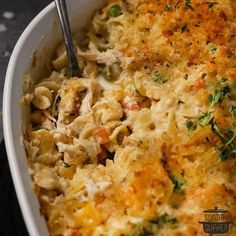 a casserole dish with chicken, noodles and vegetables in it is ready to be eaten