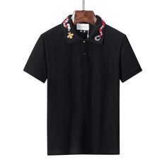 Gucci Cotton Polo Shirt With Snake Bee Embroidery In BlackGucci Cotton Polo Shirt With Snake Bee Embroidery In Black   This model reduces inventory waste and allows customers to create personalized designs. These t-shirts are made from high-quality materials and come in a range of sizes and colors, making them versatile for any occasion. Designer Embroidered Black Shirt, Designer Black Embroidered Shirt, Black Collared T-shirt With Embroidered Logo, Designer Black Polo Shirt With Embroidered Logo, Designer Embroidered Collared Tops, Embroidered Black Collared Shirt, Black Embroidered Collared Shirt, Black Embroidered Top With Collar, Designer Embroidered Cotton Top