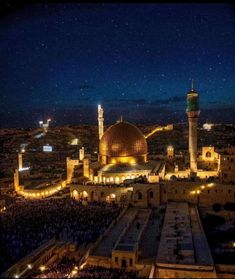 an aerial view of the old city at night, with lights shining on the buildings